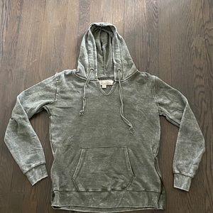 Cute unworn green hoodie with side zippers